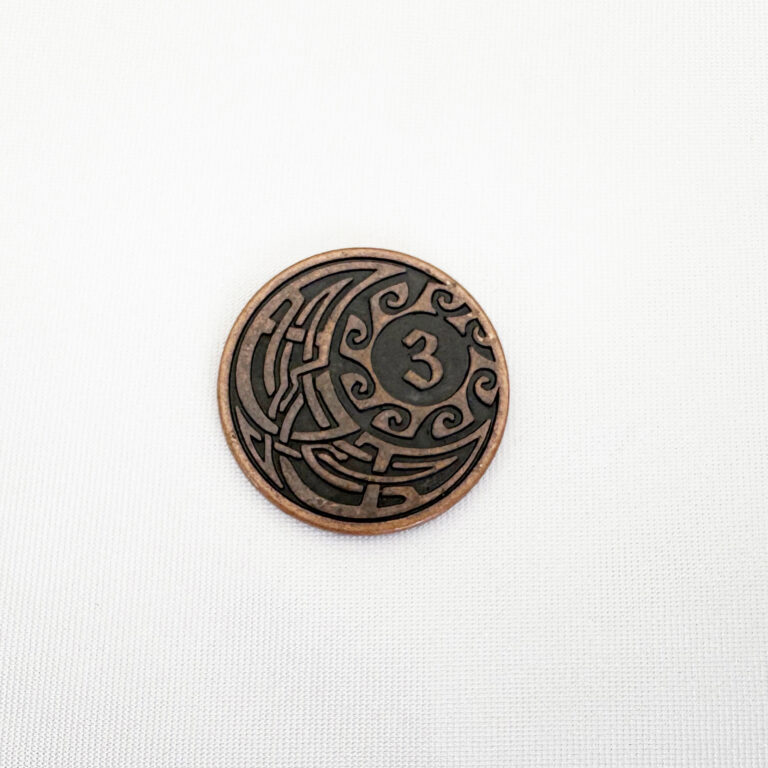 Antique copper plated metal game coin with value 3 and tribal swirl rim, custom denomination token for a board game